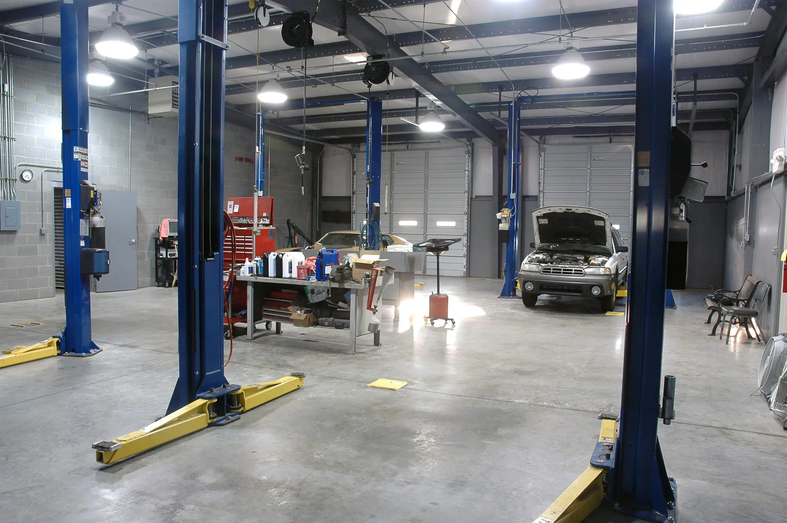 Auto repair shop interior with lifts